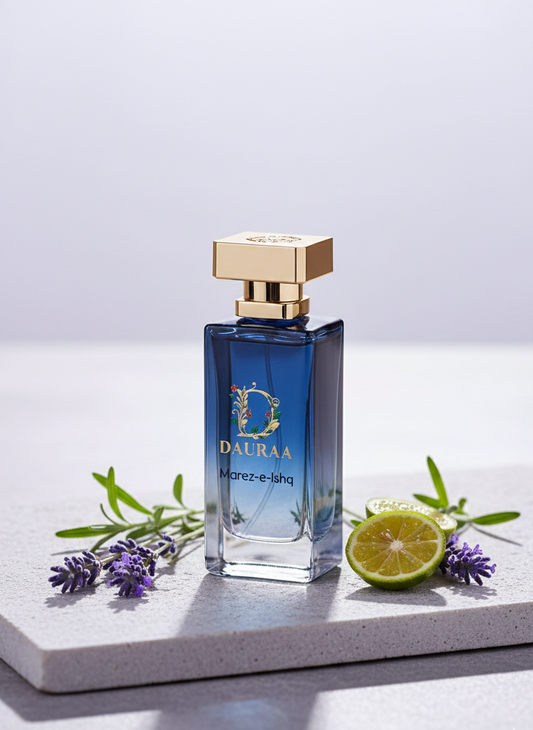 Blue perfume bottle with gold cap on a white surface with decorative elements